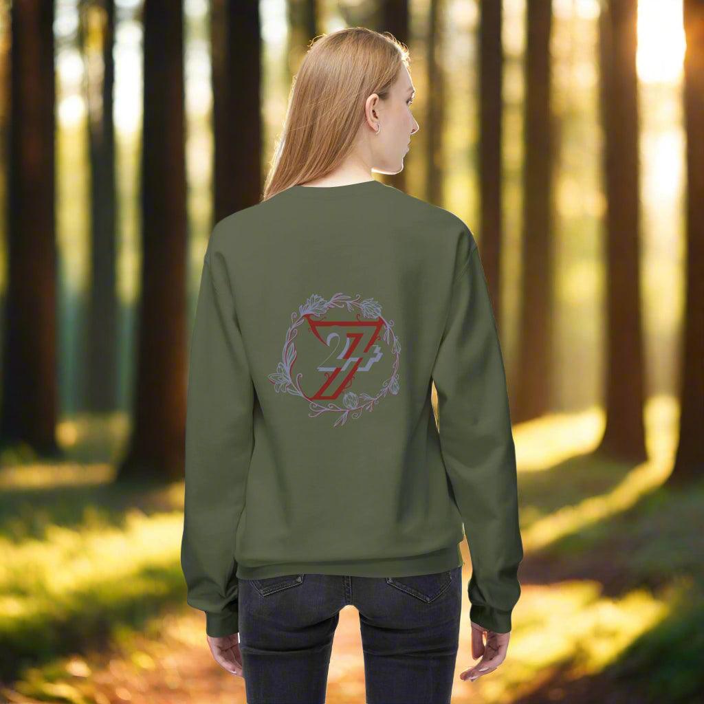 Woman facing away in an olive green casual sweatshirt showing a large back print flower design.
