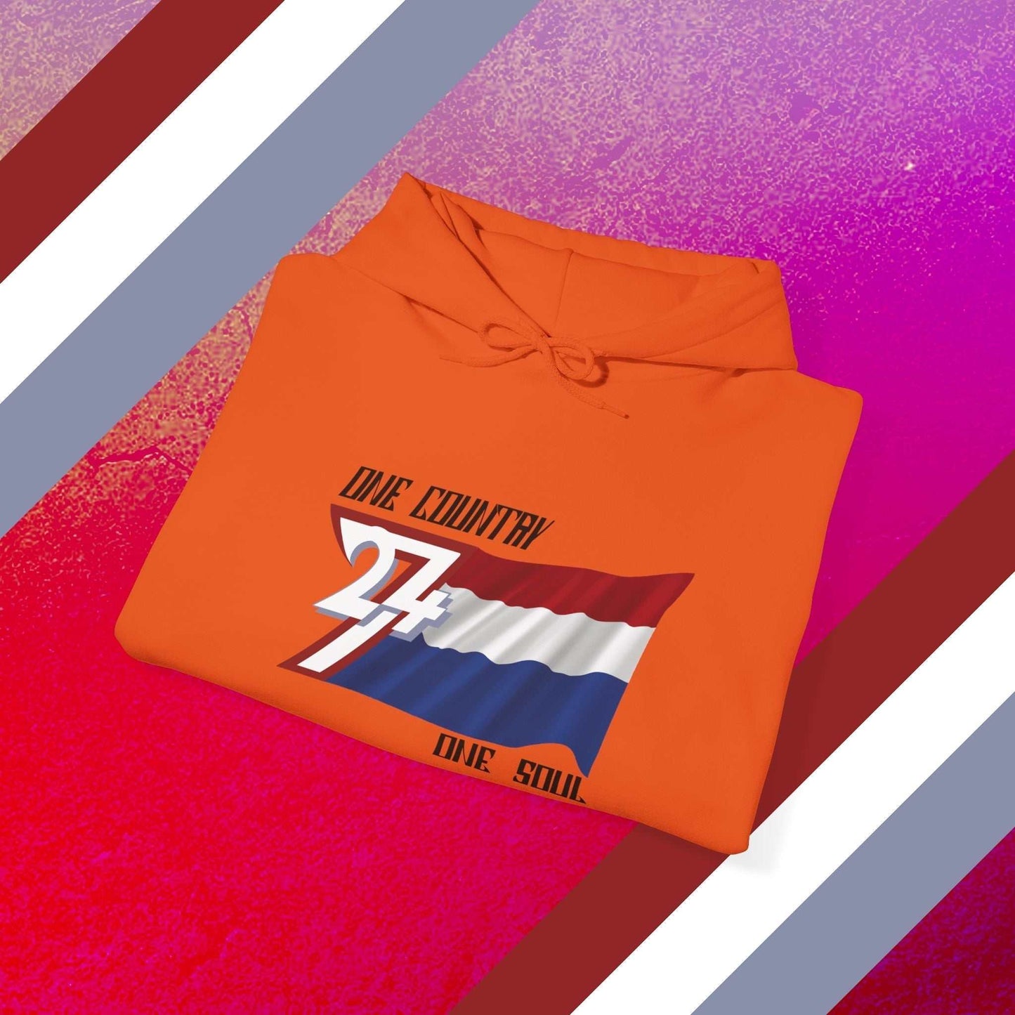 A professional display of the Nederland flag hoodie in Orange, folded to showcase the refined hand-drawn graphic and 8oz fabric weight.