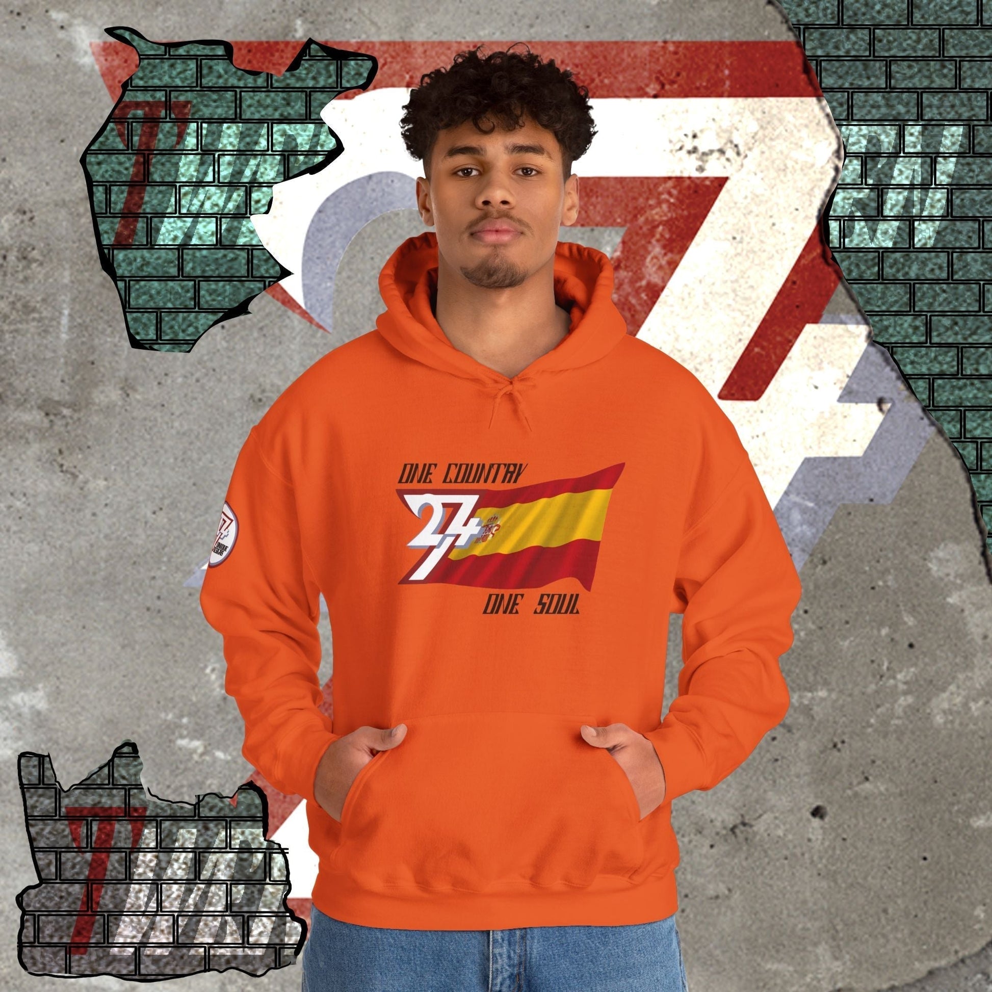 Model wearing the España "Pasión" edition hoodie in Orange, showing a modern, refined Mediterranean streetwear look.