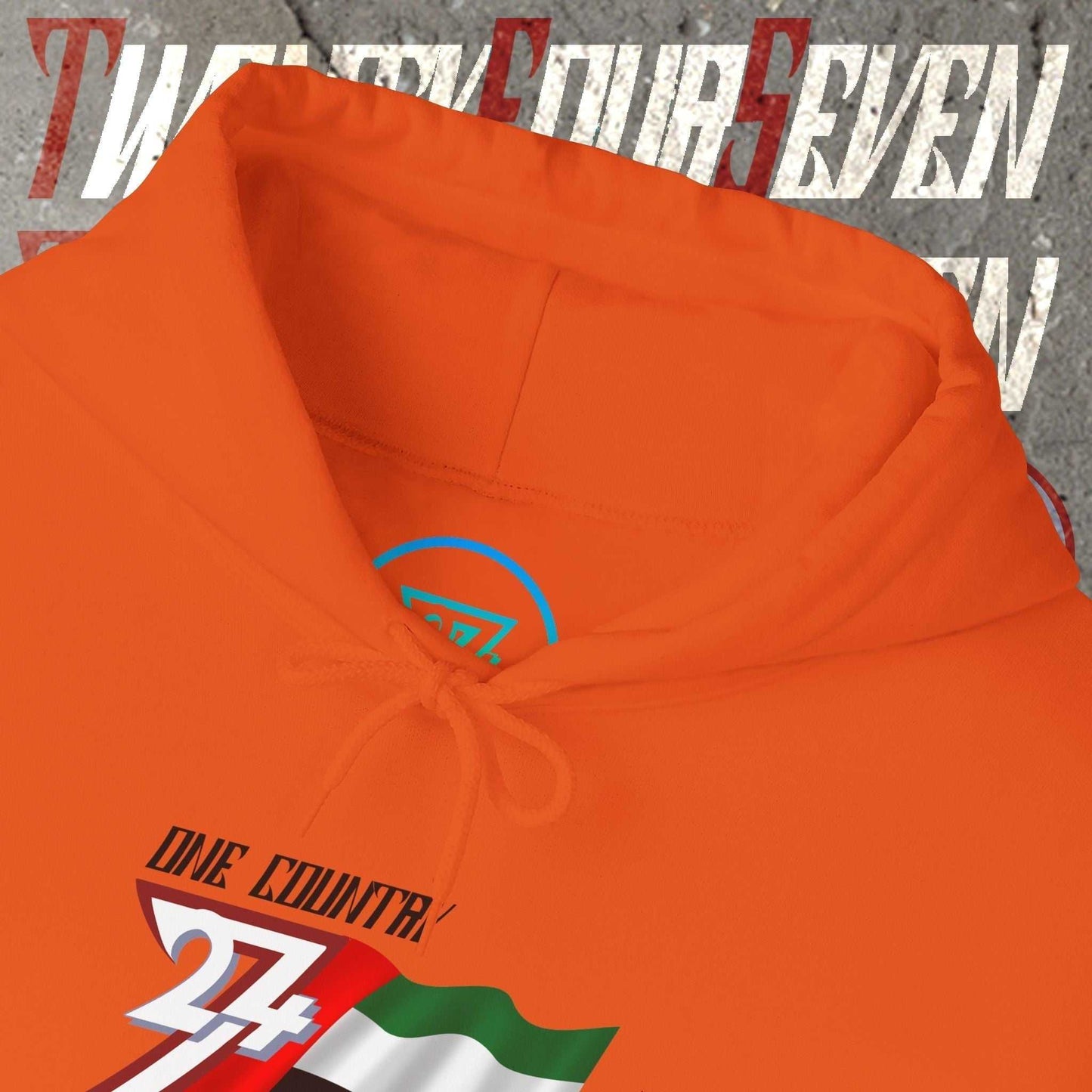 Macro close-up of the inner neck area showing the authentic 24/7 Unique Designs trademark logo on the UAE hoodie.