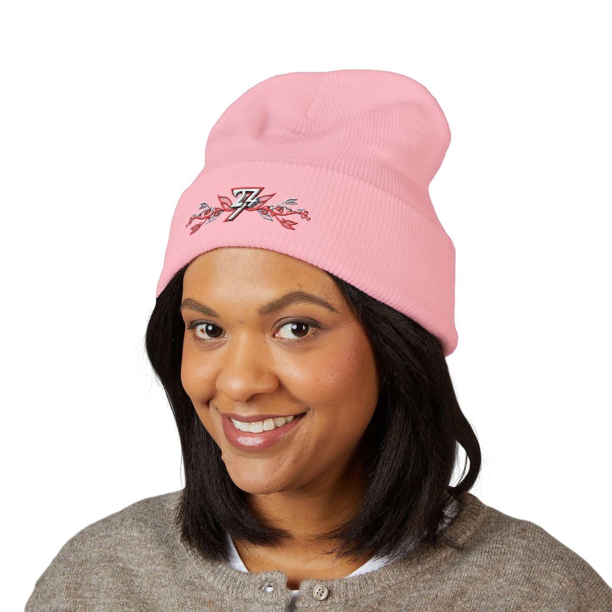 Front view of a female model wearing the baby pink 24/7 Unique Designs floral beanie.