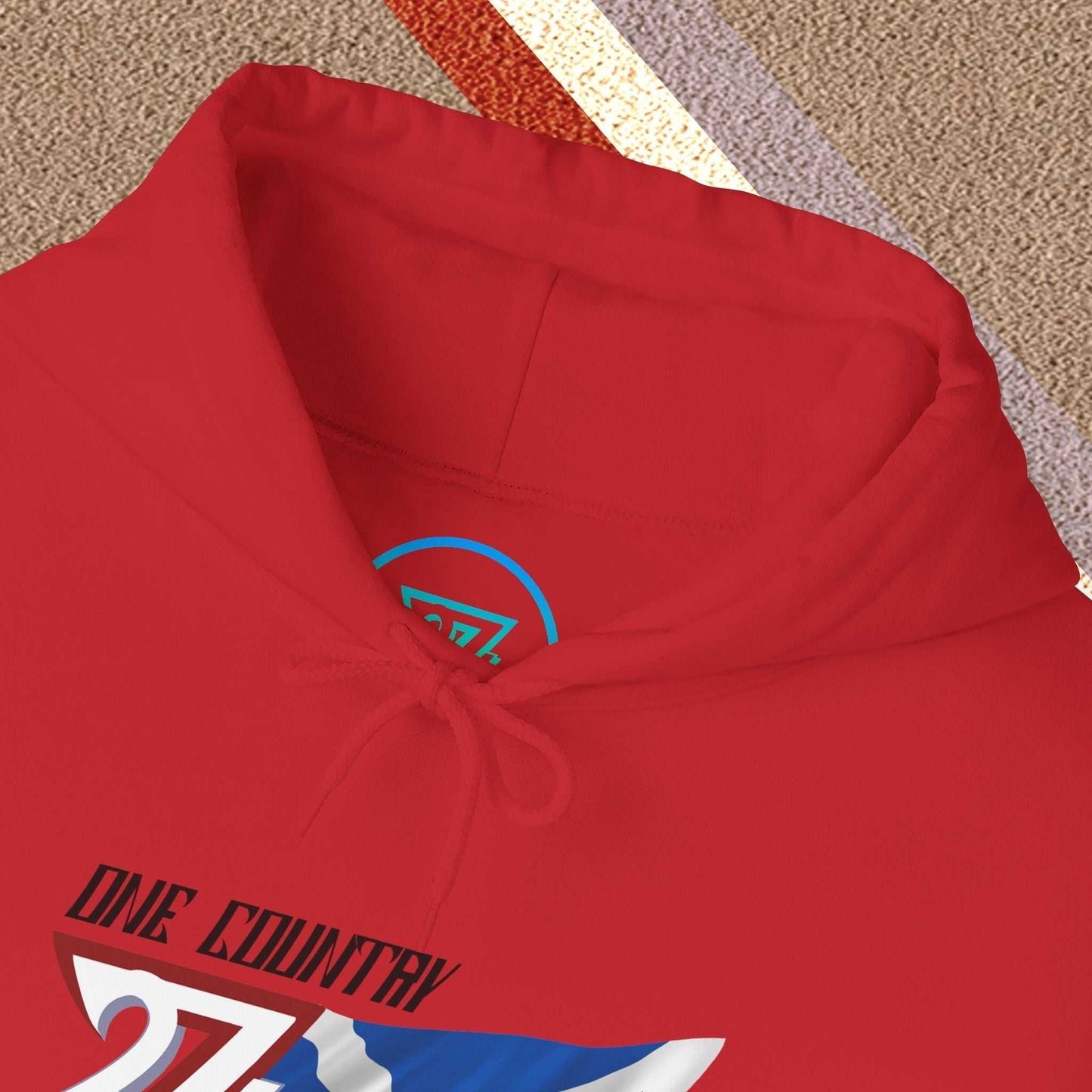 Macro close-up of the inner neck area showing the tear-away label and authentic 24/7 Unique Designs trademark logo.