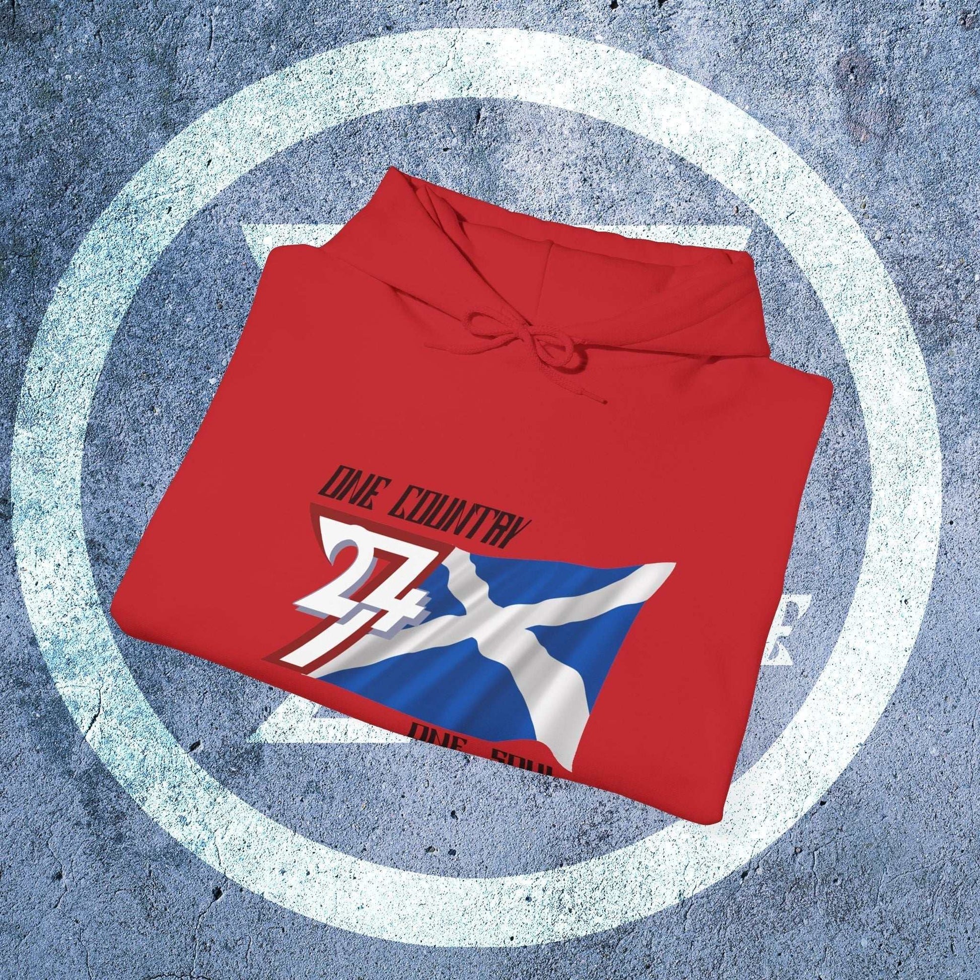 A professional display of the Scotland flag hoodie in Red, folded to showcase the refined hand-drawn graphic and 8oz fabric weight.