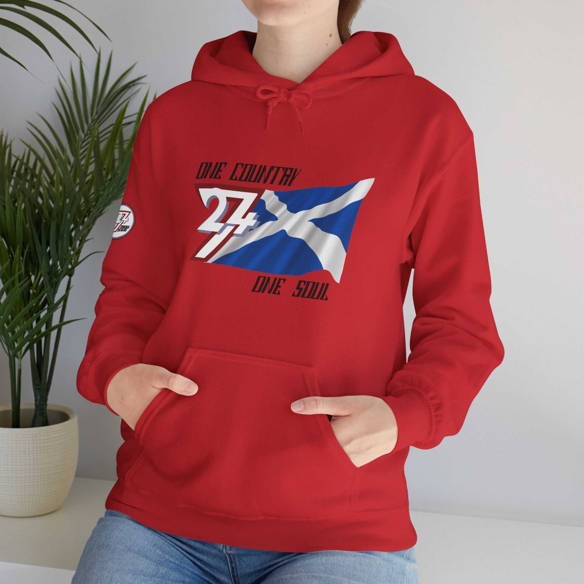 Female model wearing the Alba "Highland" edition hoodie in Red, showing a modern, refined Scottish streetwear look.