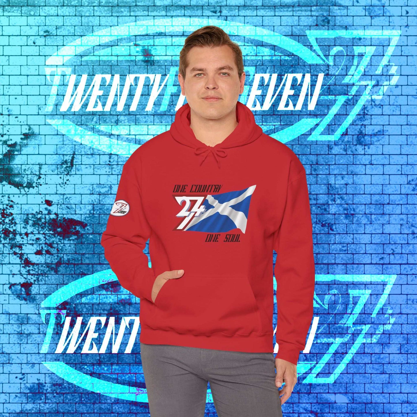 Male model wearing the Alba "Highland" edition hoodie in Red, showing a modern, refined Scottish streetwear look.