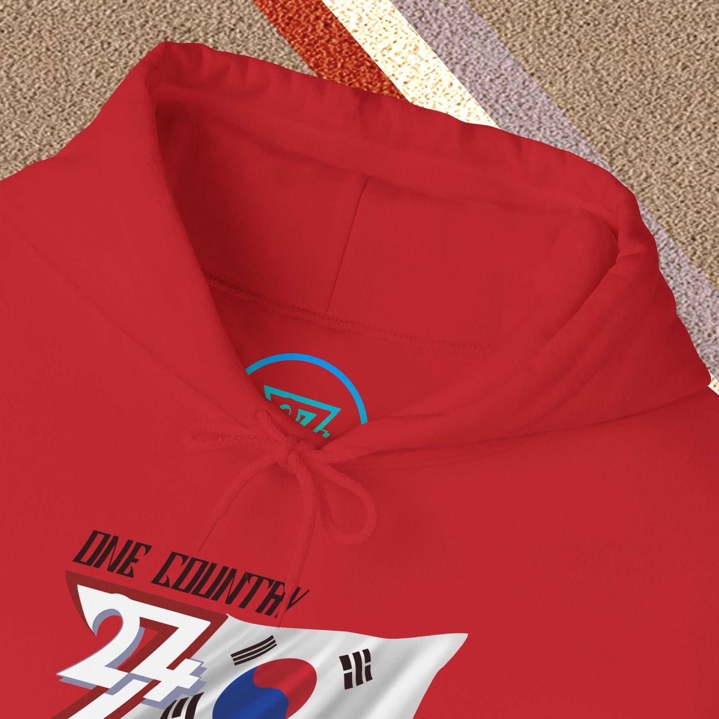 Macro close-up of the inner neck area showing the tear-away label and authentic 24/7 Unique Designs trademark logo.