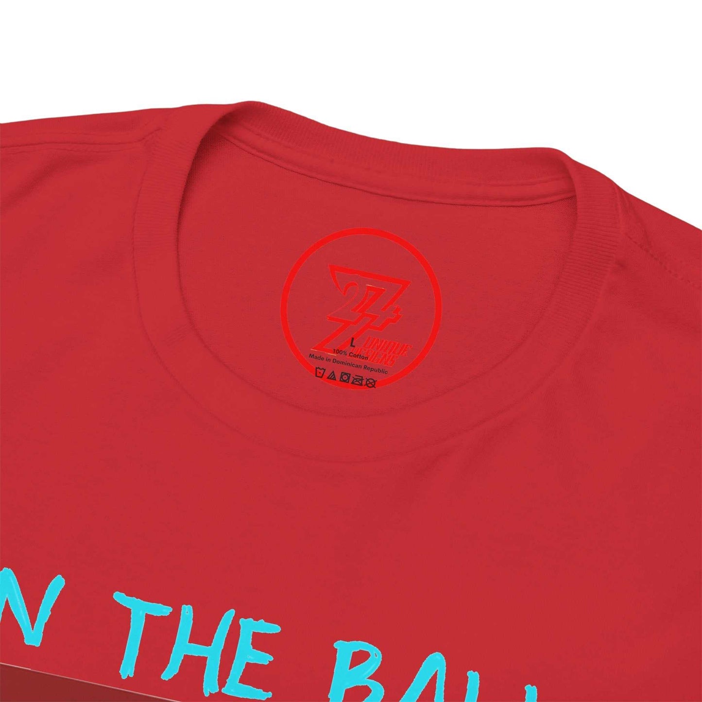 Close-up of the clean crew neckline on the red hand-drawn sports shirt, clearly showing the official 24/7 Unique Designs trademark logo inner label branding.