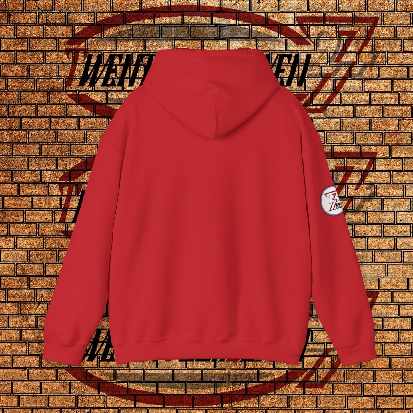 red streetwear hoodie with hood and logo patch on sleeve displayed against brick wall background