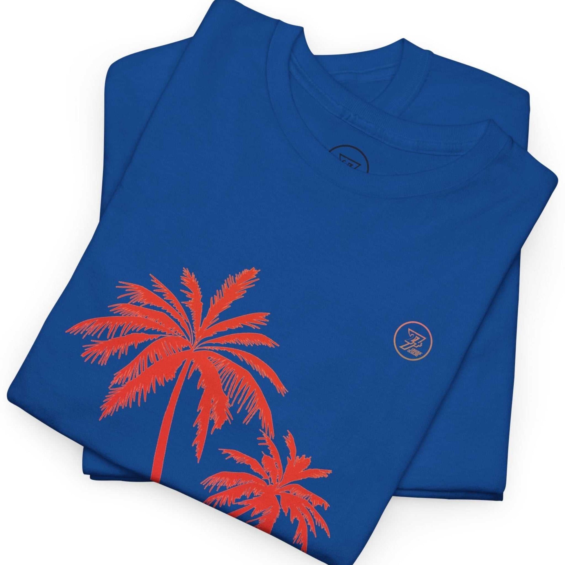 Folded blue t-shirt with retro palm tree design on a white background