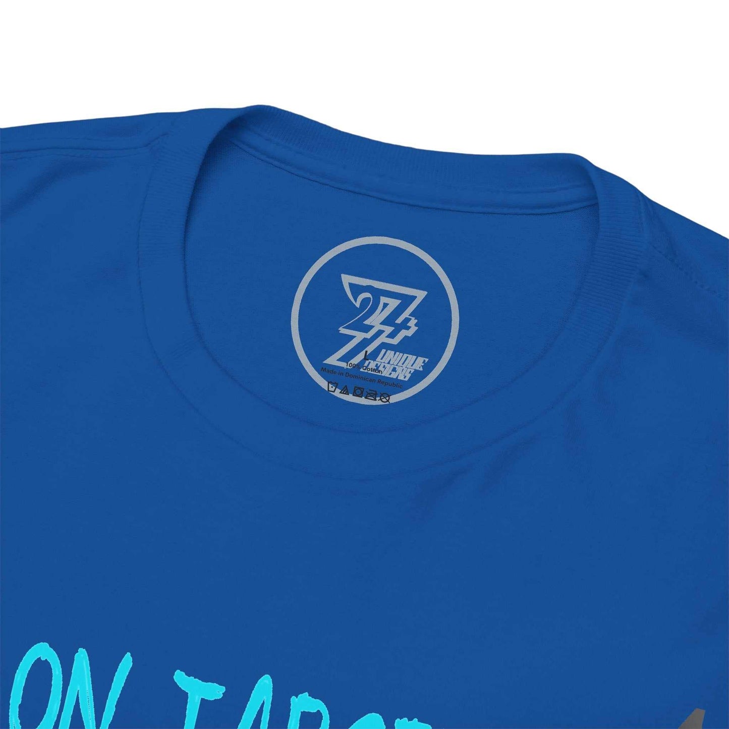 Close-up of the ribbed knit collar on the royal blue clubhouse apparel tee, clearly showing the official 24/7 Unique Designs trademark logo inner label branding.