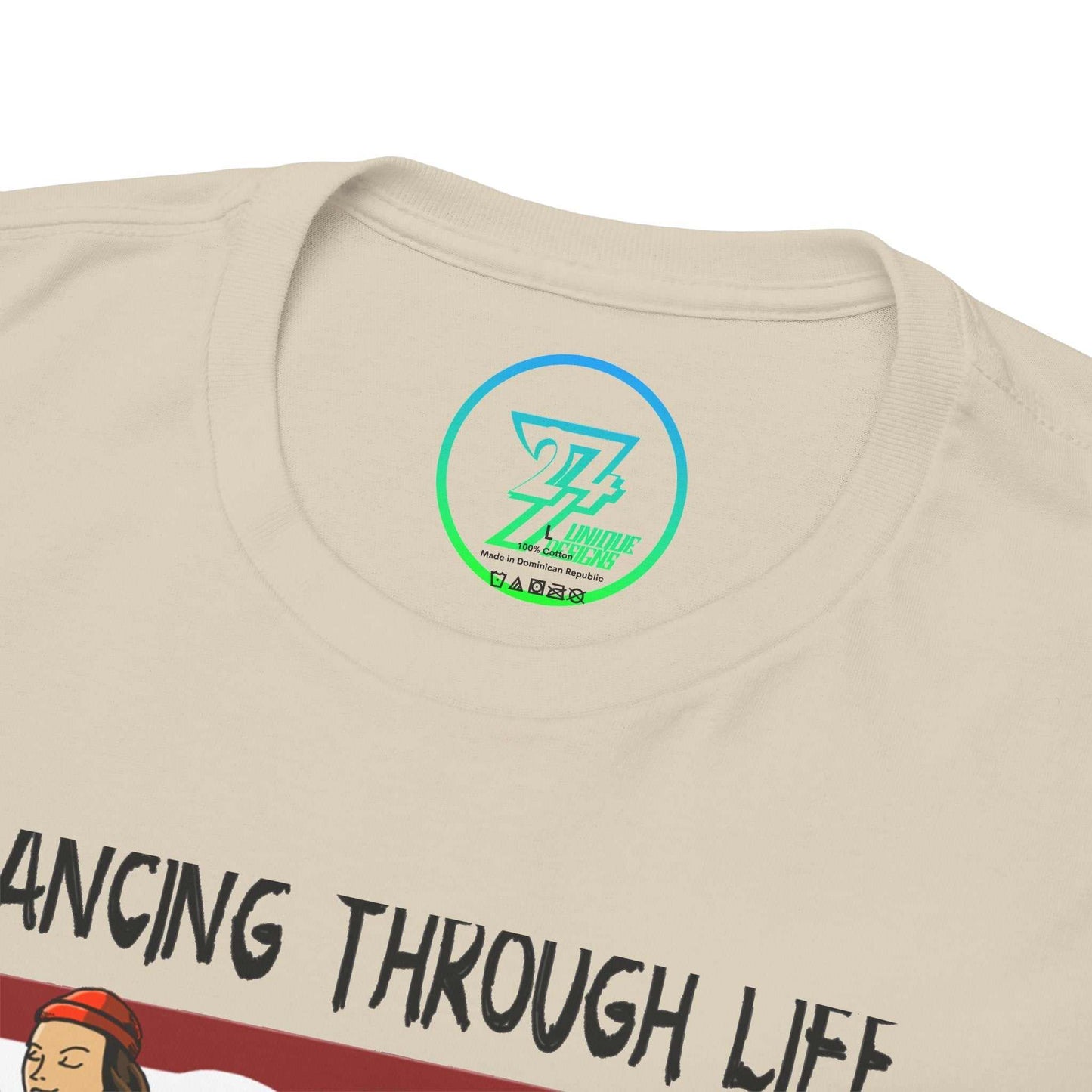 Close-up of the ribbed crew neckline on the sand dance shirt, clearly showing the official 24/7 Unique Designs trademark logo inner label branding.