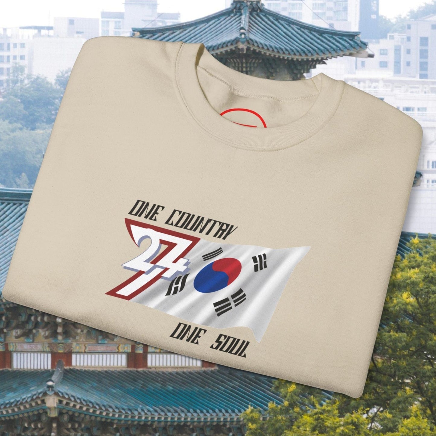 Folded beige South Korean Flag Sweatshirt with hand-drawn graphic and "One Country One Soul" text on chest