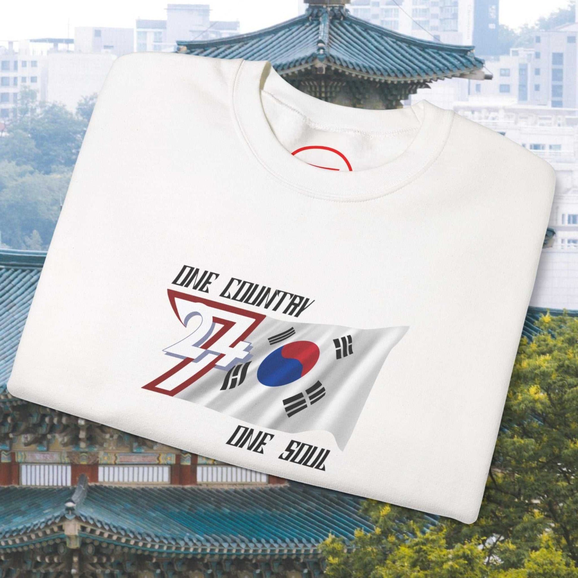 white South Korean flag sweatshirt with hand-drawn Korean graphic and "One Country One Soul" text on chest
