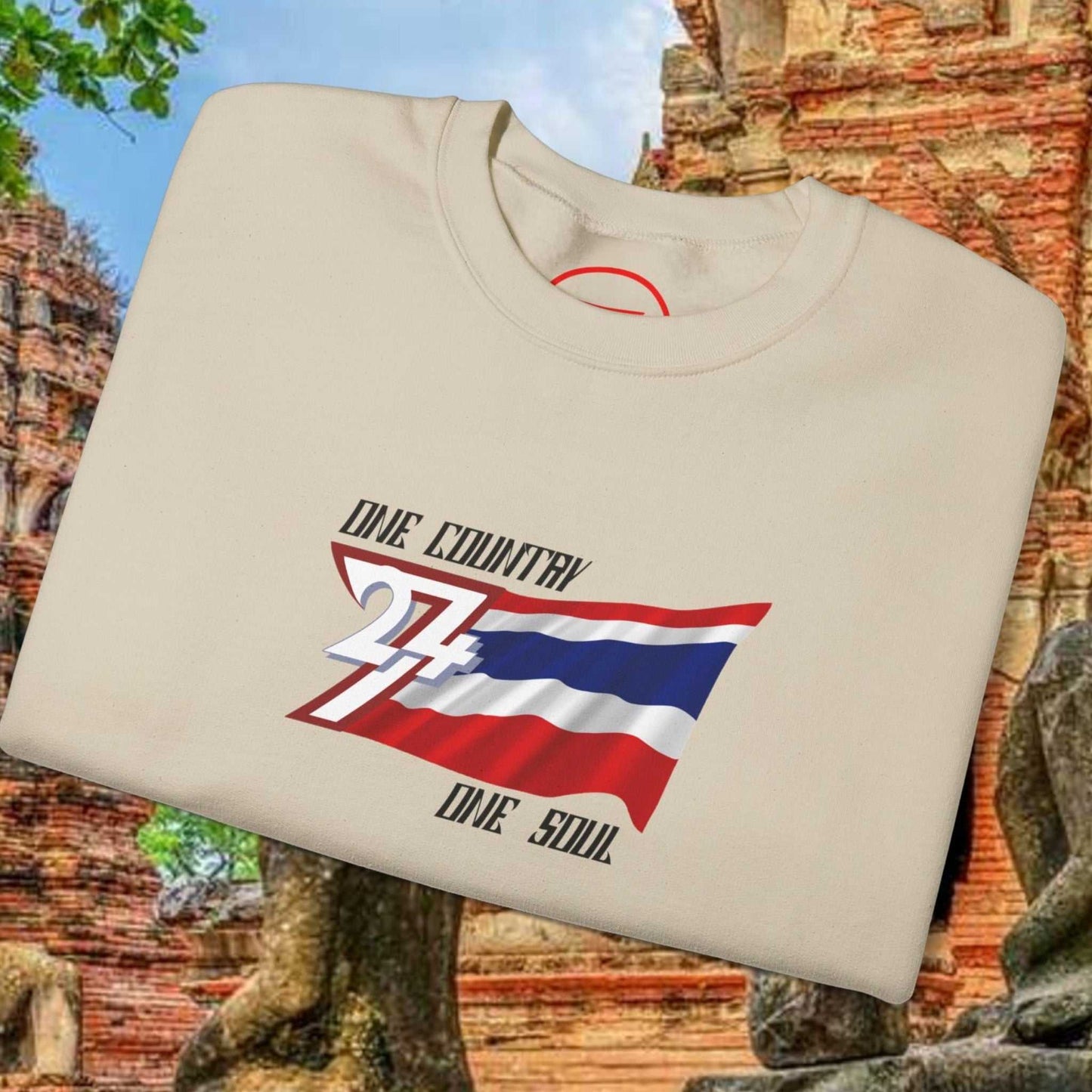 Thailand Flag Sweatshirt beige crewneck with bold hand-drawn Thai flag and "One Country One Soul" text on front, displayed on ancient temple background