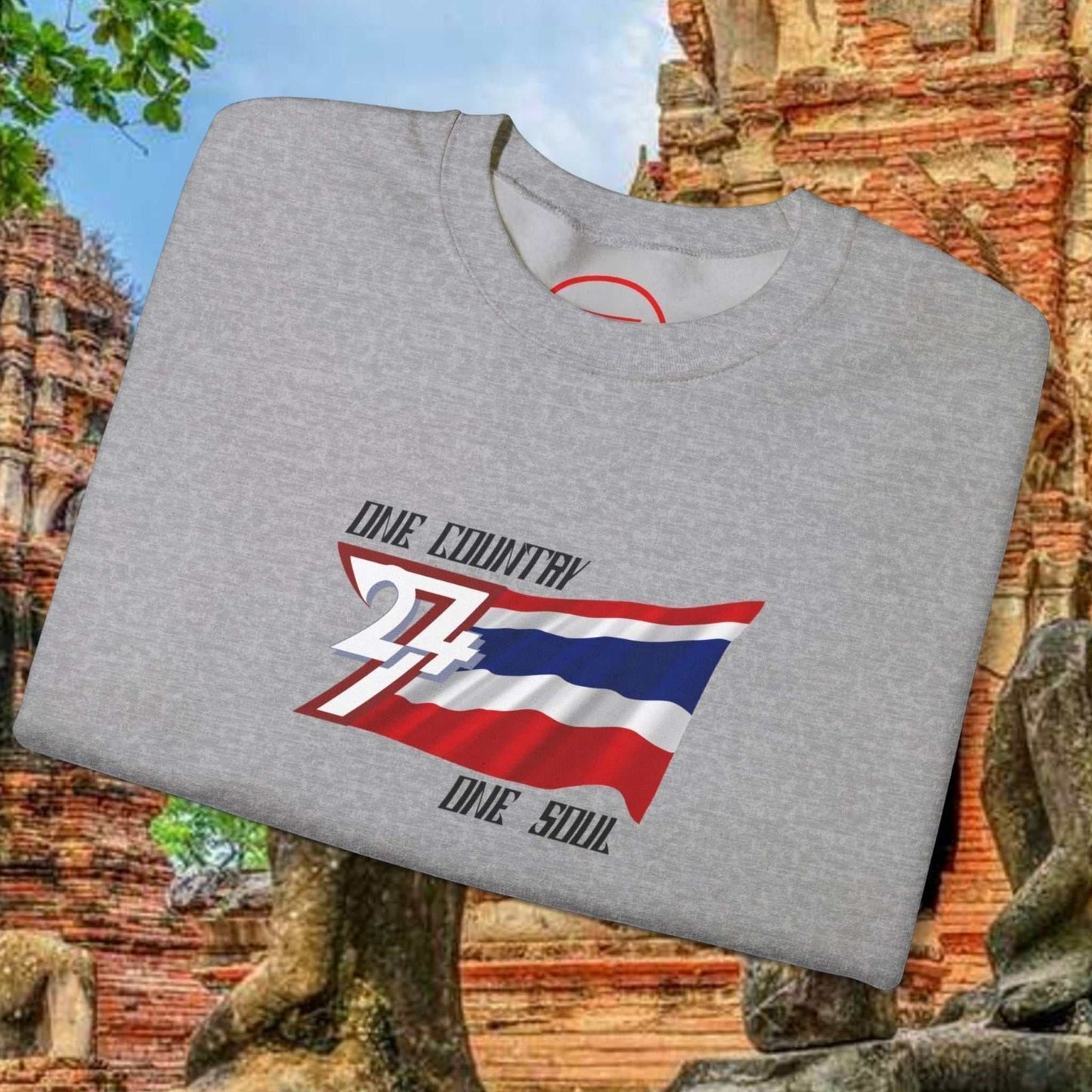 Gray Thailand Flag Sweatshirt with "One Country One Soul" text folded on ancient temple background