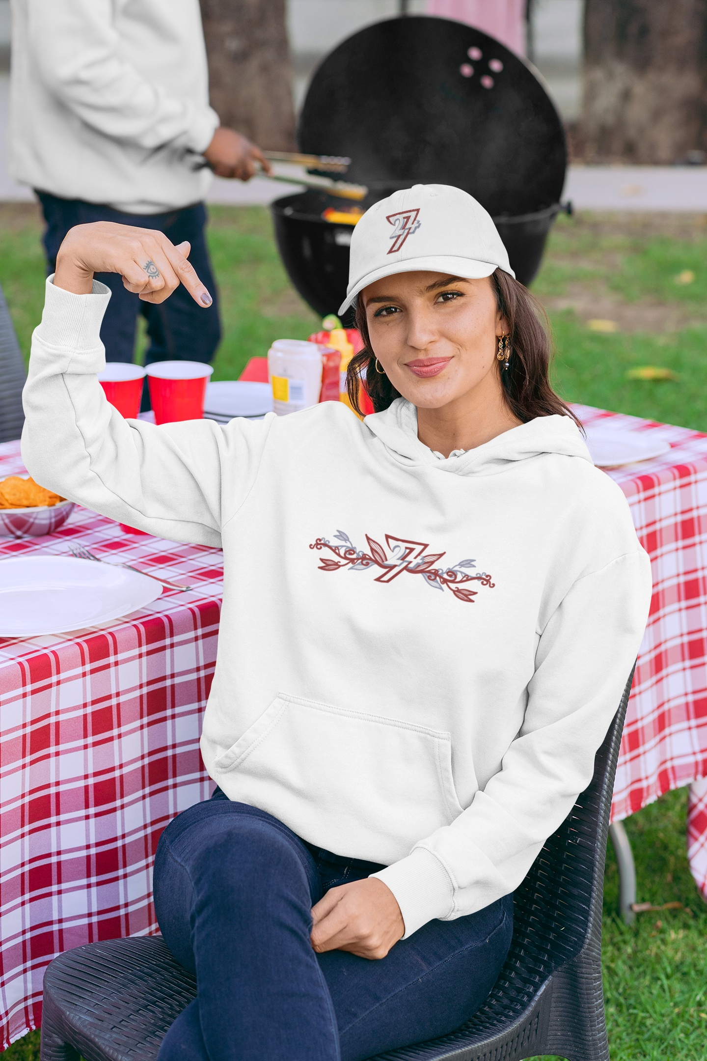 Woman wearing the white tri-color logo baseball cap