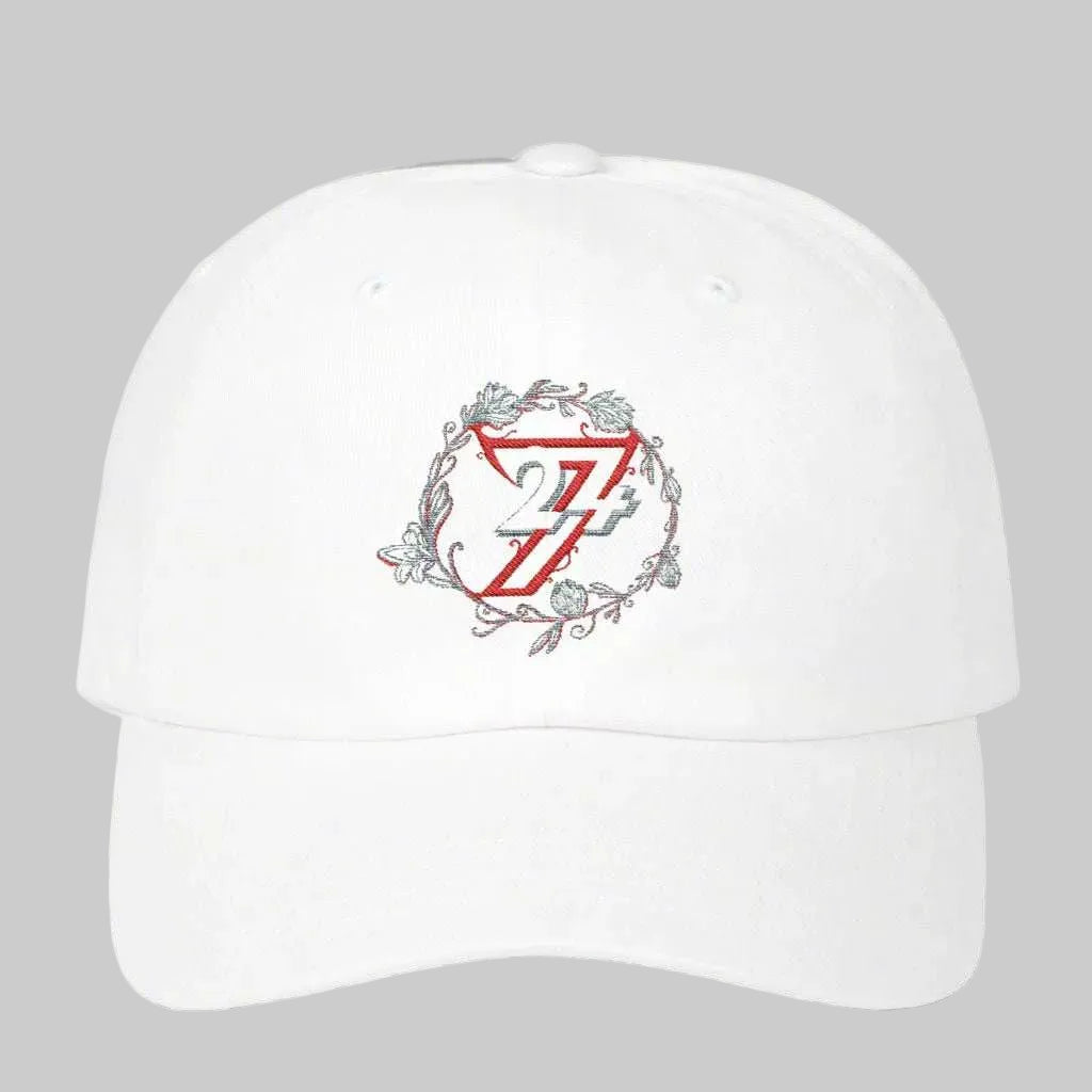 Front view of a white 24/7 Unique Designs floral embroidered baseball cap.