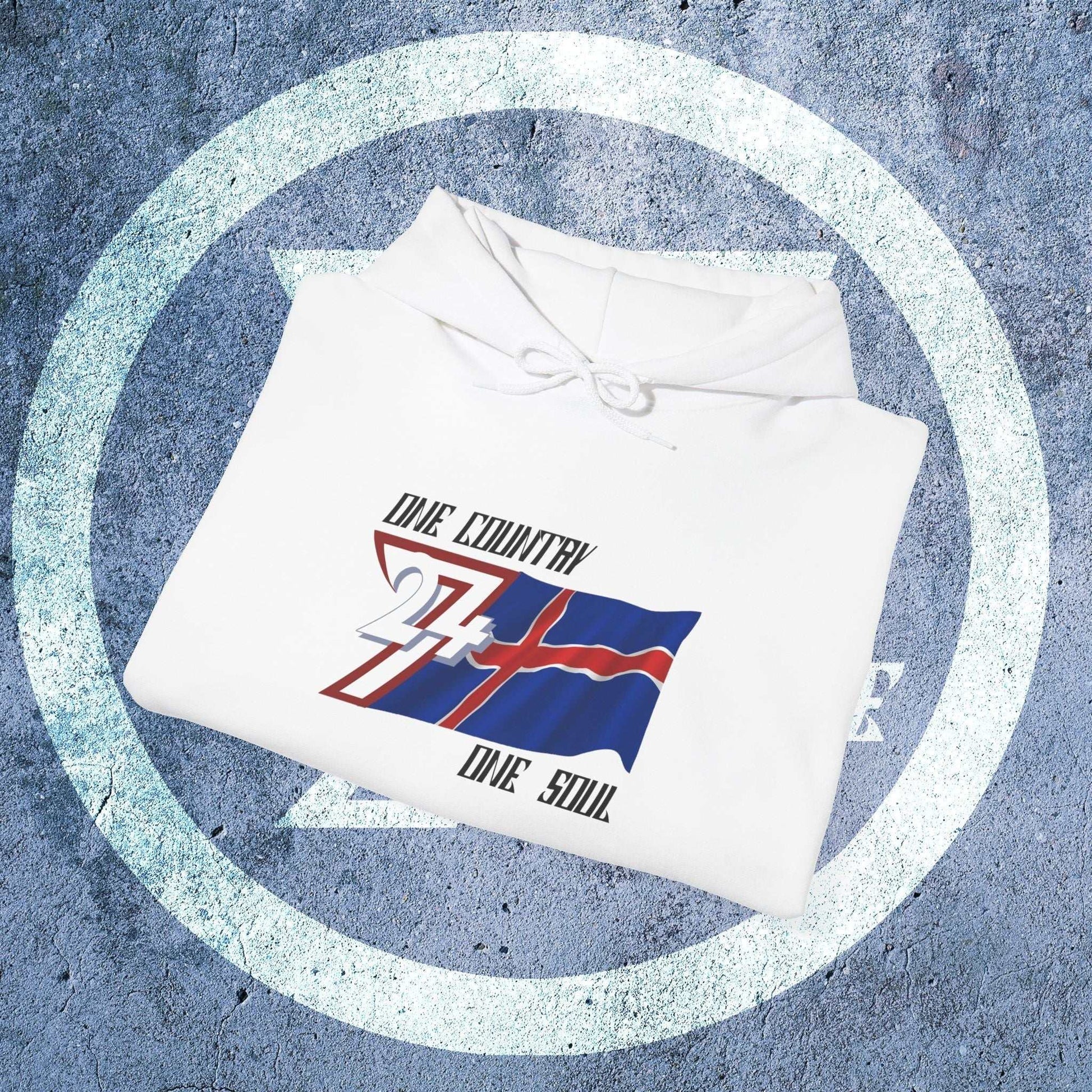 A professional display of the Ísland flag hoodie in White, folded to showcase the refined hand-drawn graphic and 8oz fabric weight.