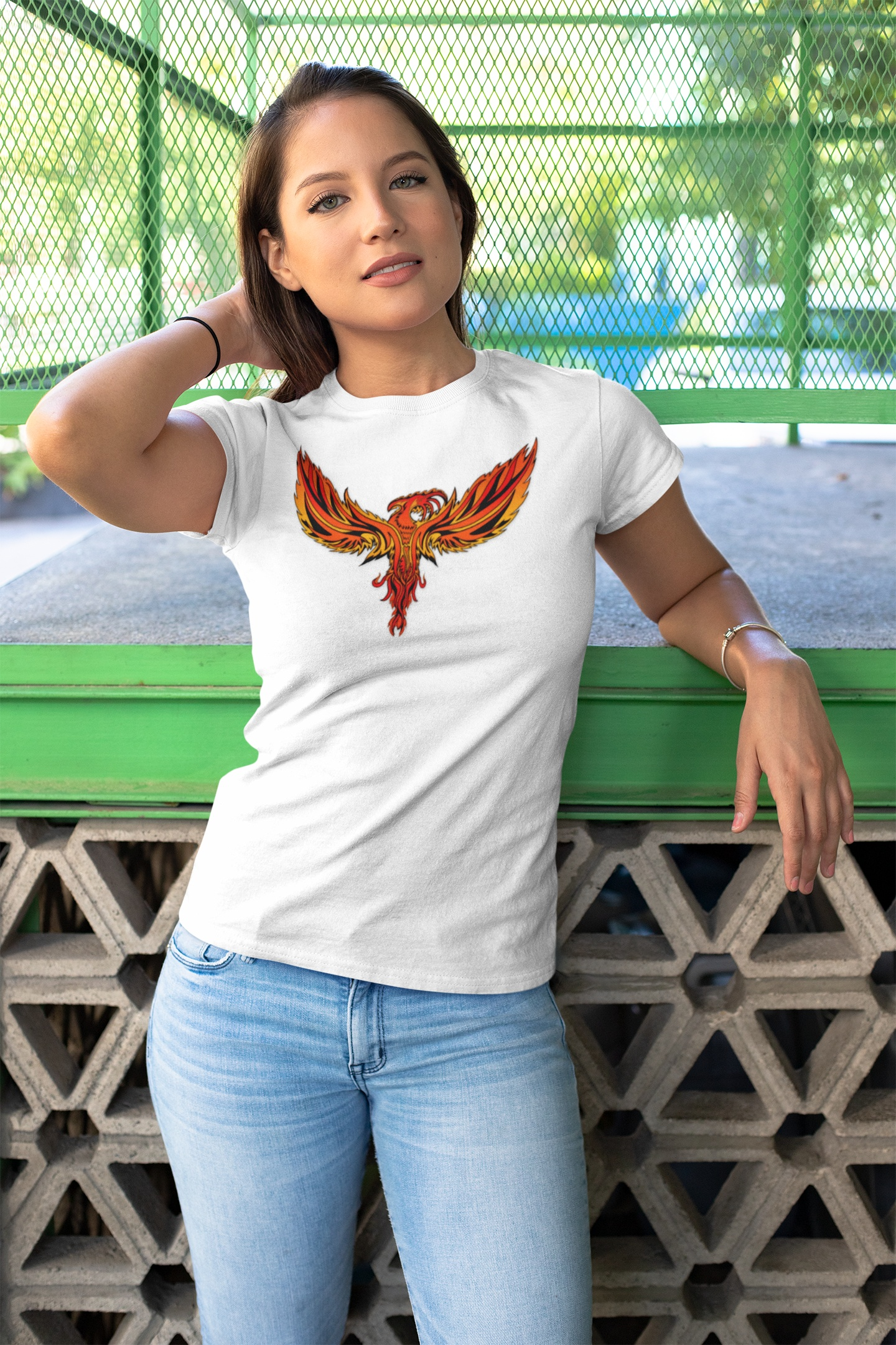 Woman wearing white Phoenix Tee with vibrant fiery phoenix design