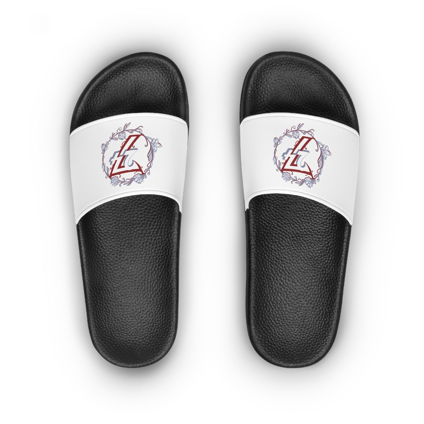 Black slides with white straps featuring 24/7 floral wreath designs on a white background