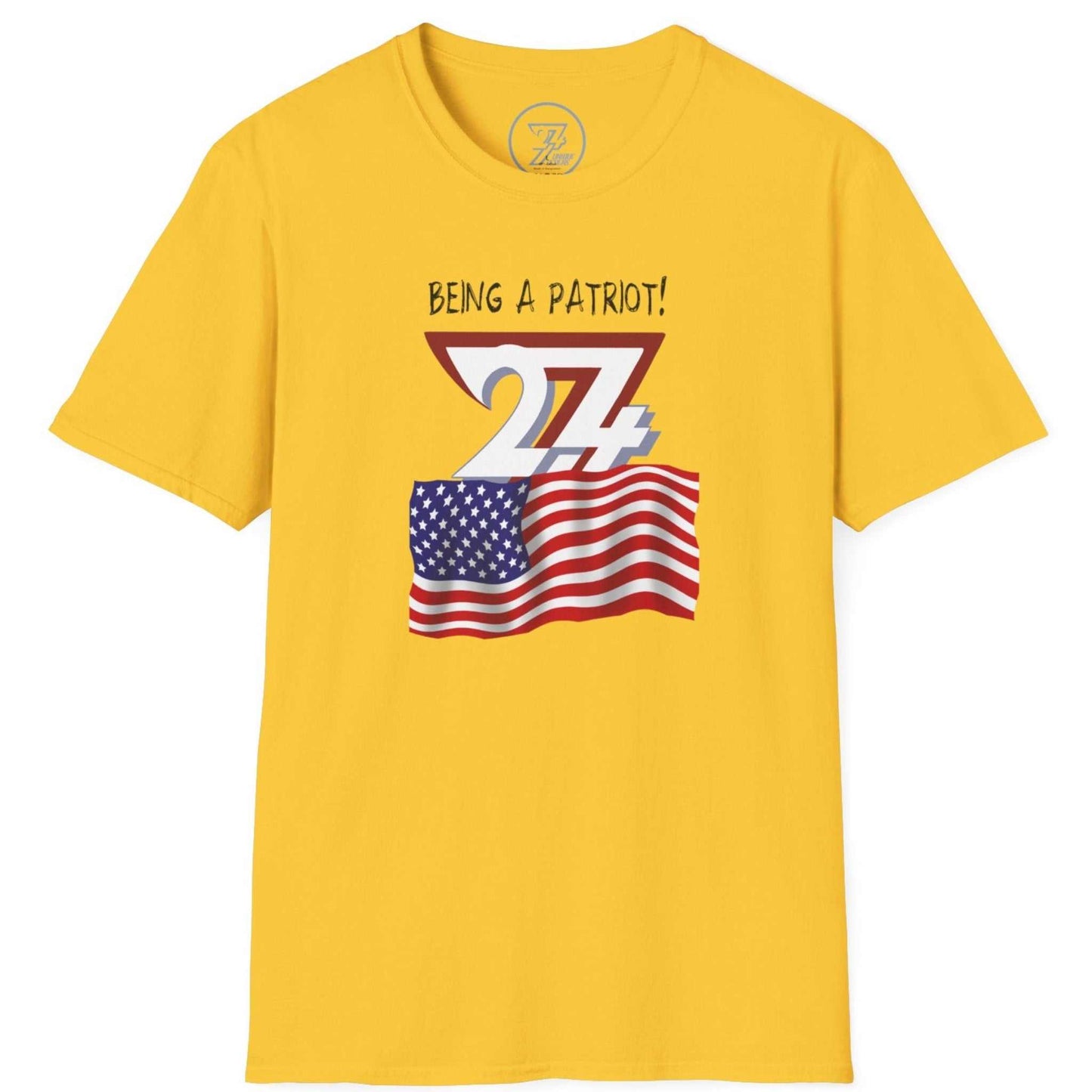 Yellow t-shirt with American flag graphic and Being a Patriot! text and 24/7 logo on a white background