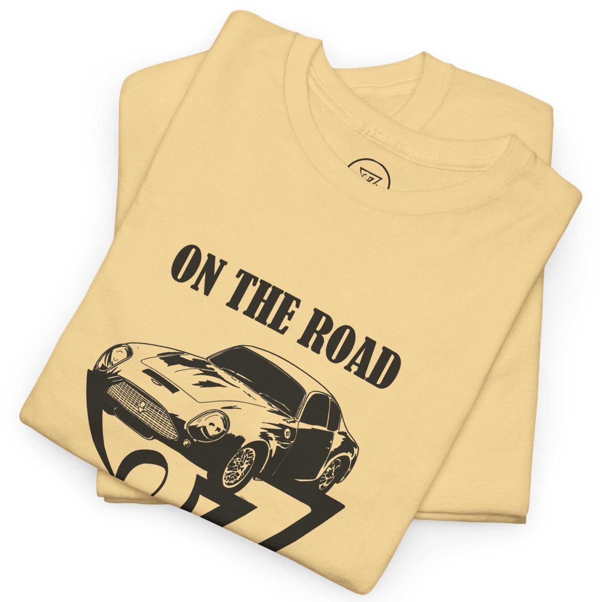 Neatly folded yellow haze British car enthusiast gift shirt highlighting the crisp black digital front print and smooth cotton fabric, laid flat.