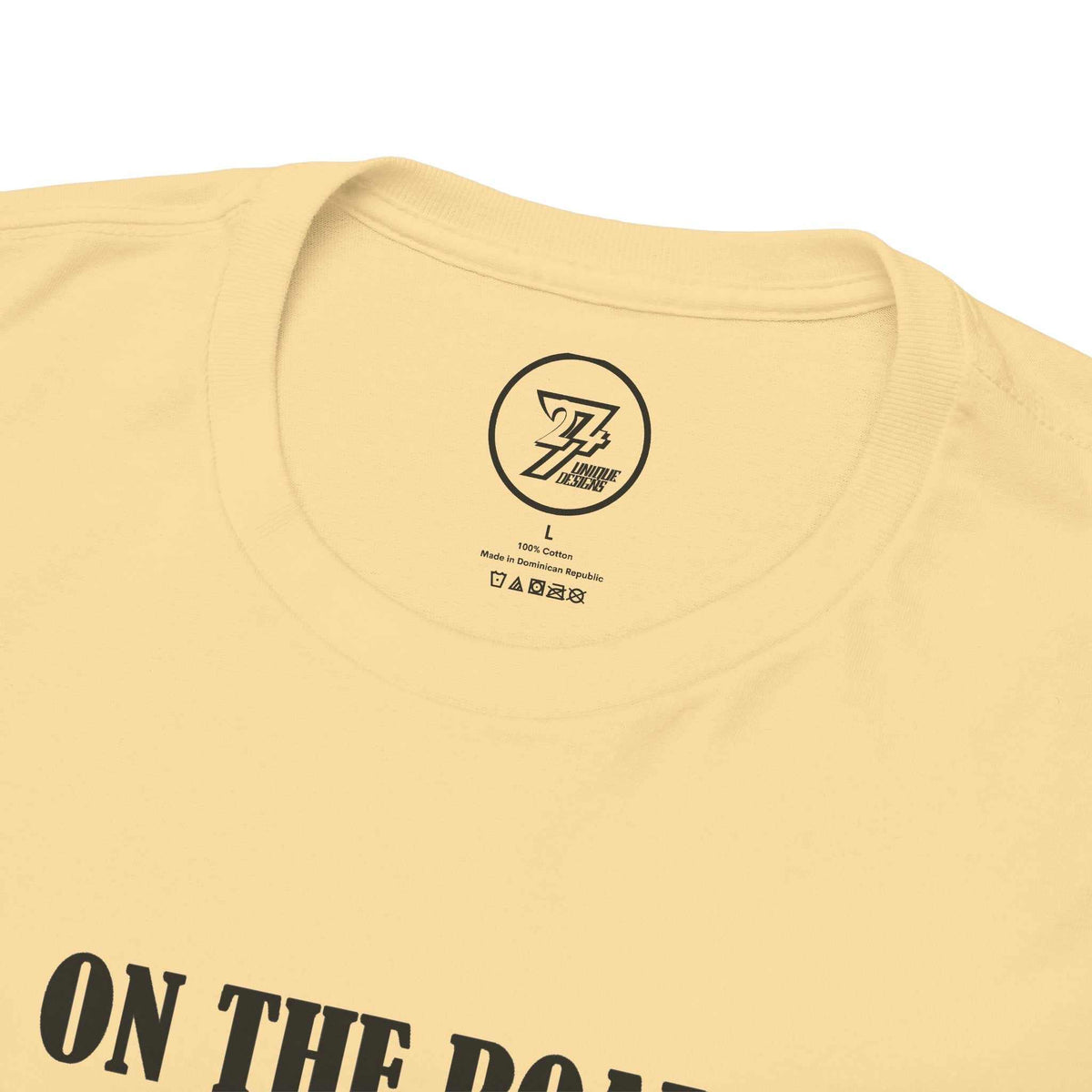 Close-up of the ribbed knit collar on the yellow haze vintage car shirt, clearly showing the official 24/7 Unique Designs trademark logo inner label branding.